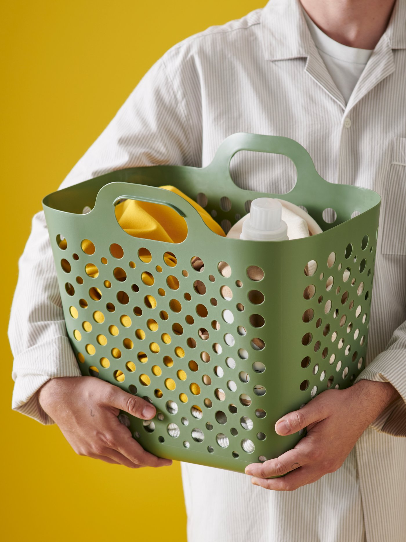 A green SLIBB flexible laundry basket