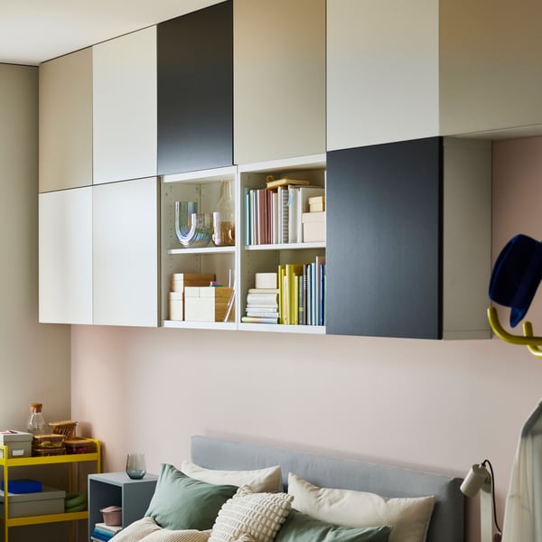 A light grey-blue EKET cabinet in the bedroom