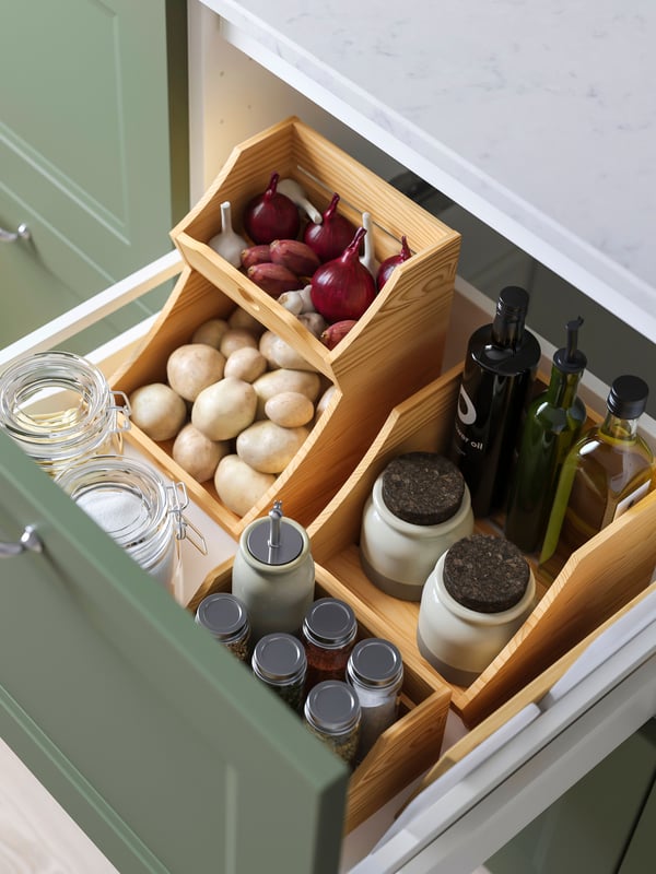 A wood CHOKLADHAJ kitchen countertop organiser in the kitchen