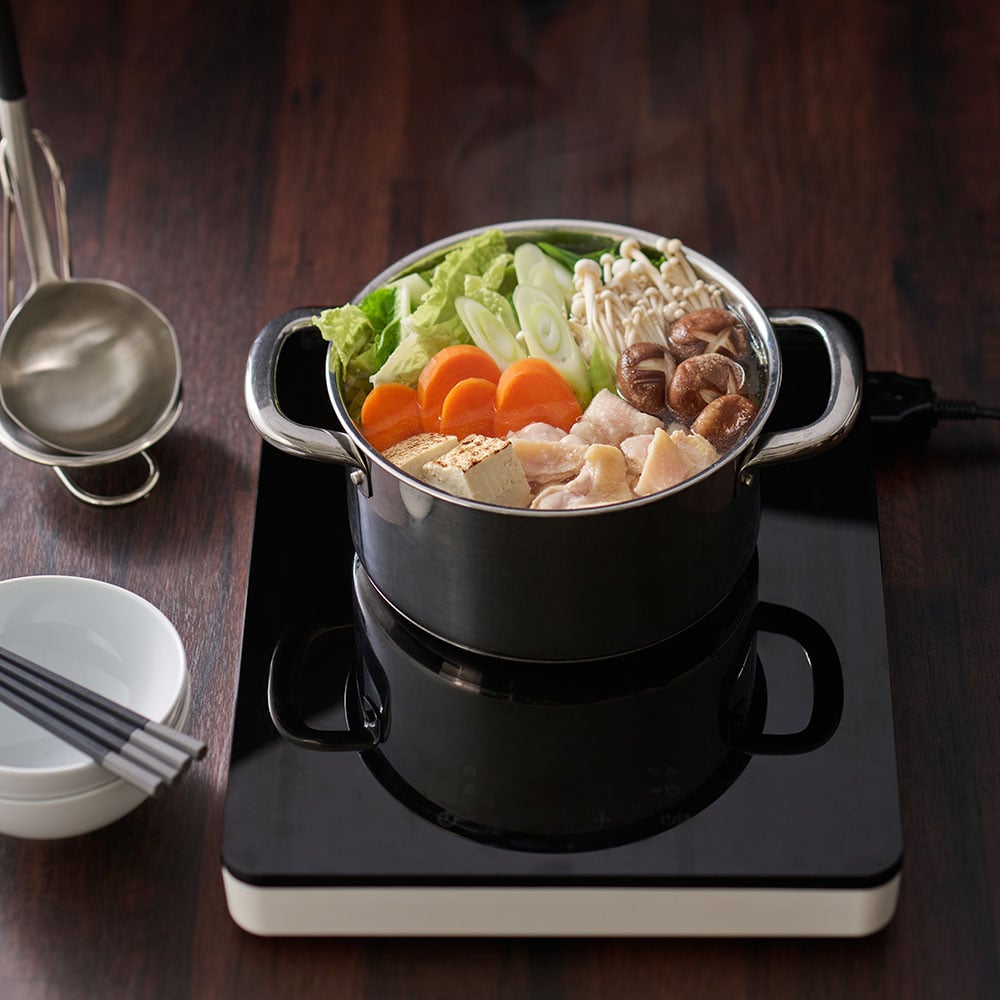 A white TILLREDA portable induction hob