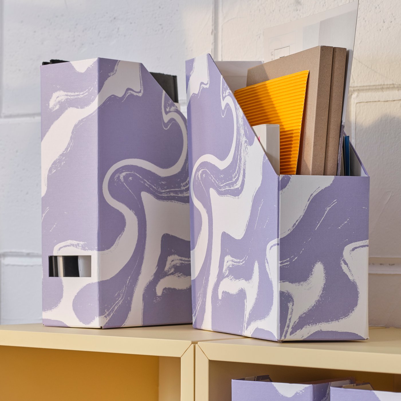 A patterned/lilac white TJENA magazine file