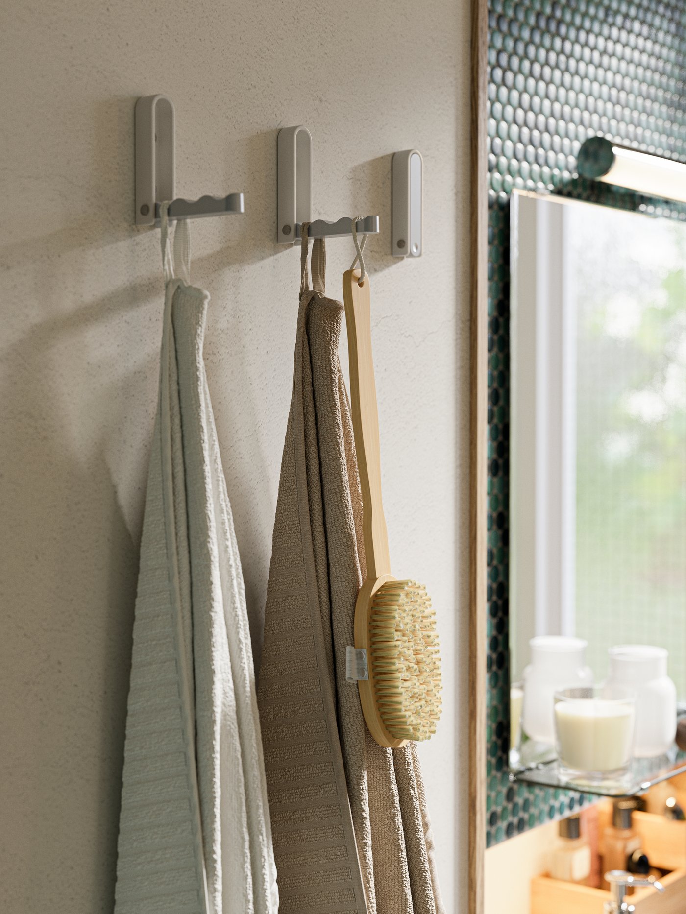 A white VÅGSJÖN bath towel in the bathroom