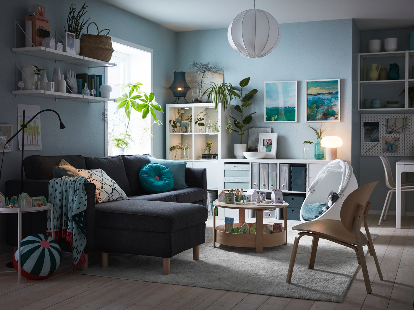 A black SKURUP floor/reading lamp in the living room