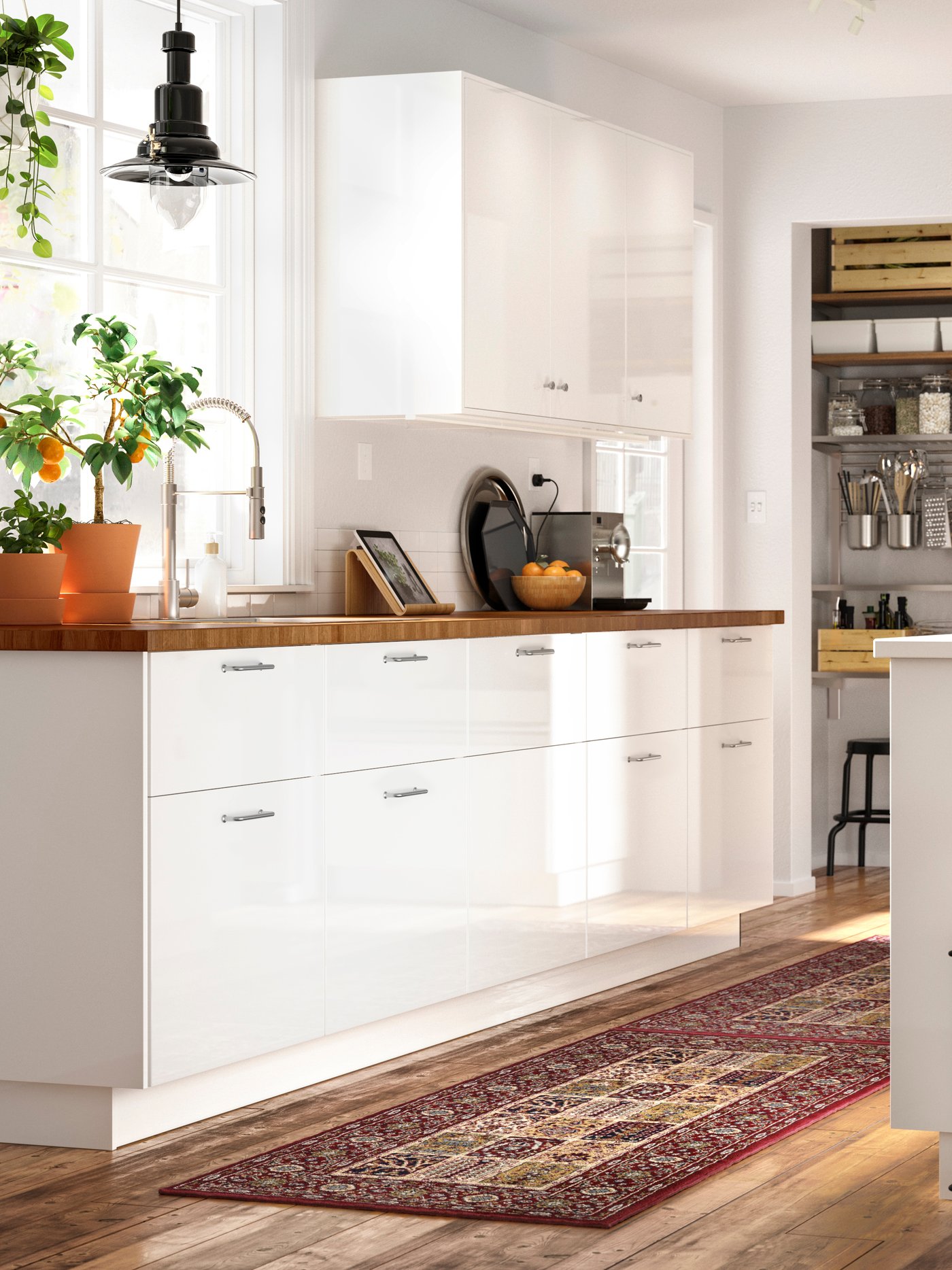 A high-gloss white RINGHULT drawer front in the kitchen