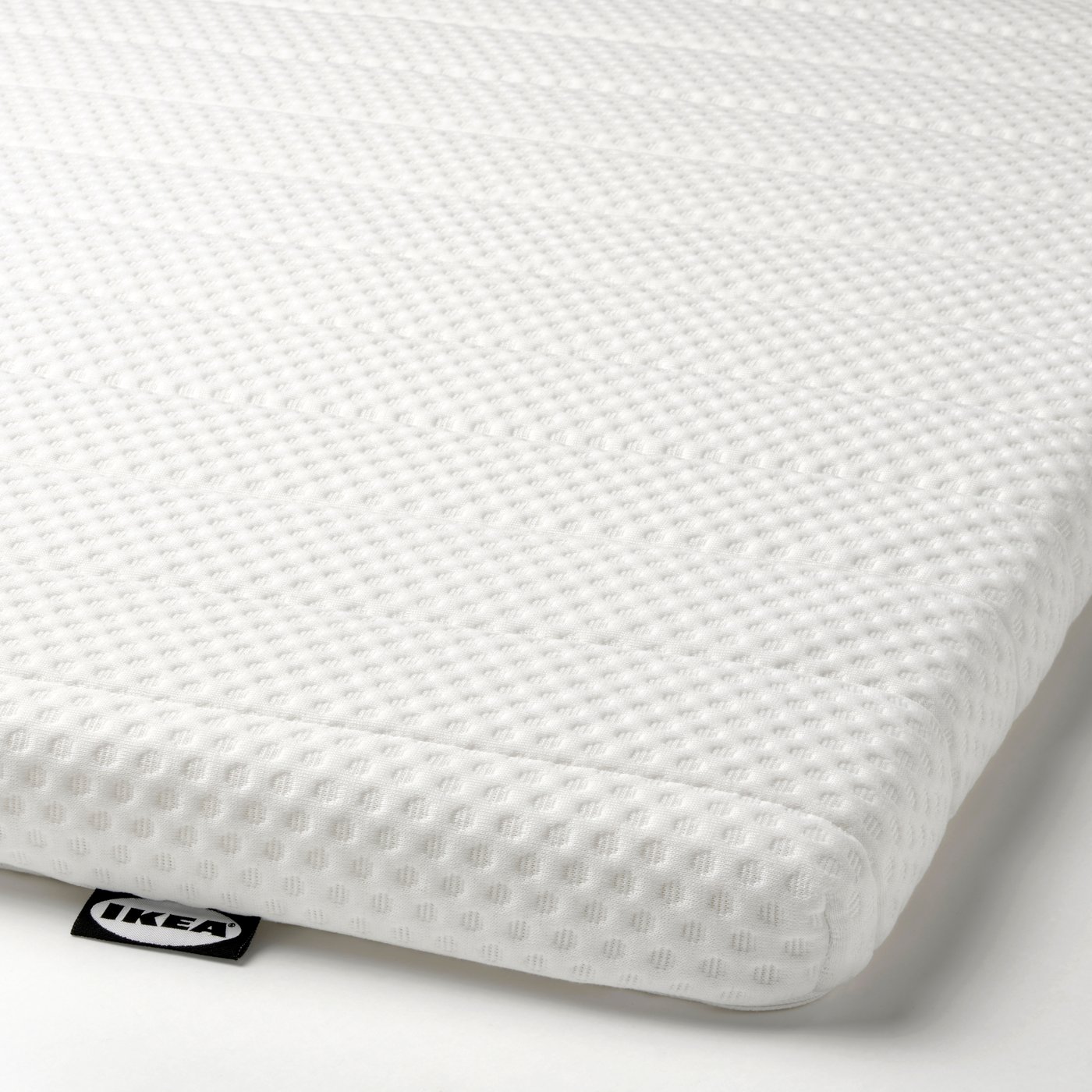 A white NISSEHOLM mattress pad