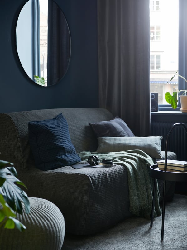 A grey SANDARED pouffe in the living room