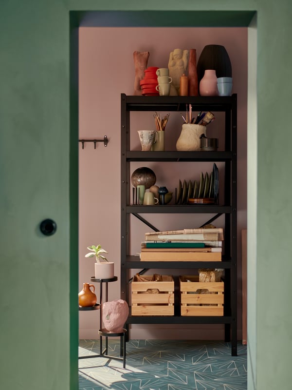 Black shelving unit in a room