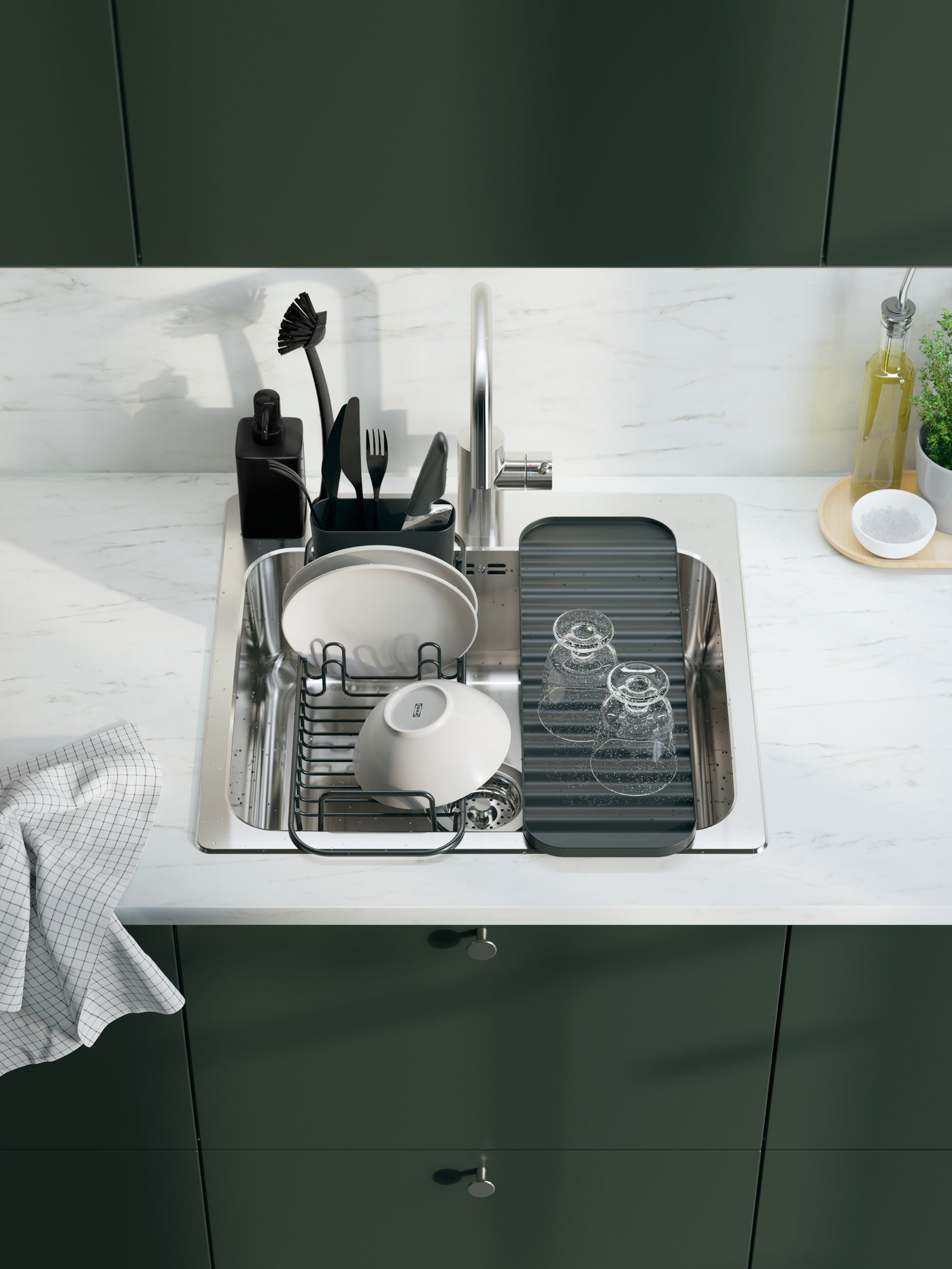 A grey RINNIG soap dispenser in the kitchen