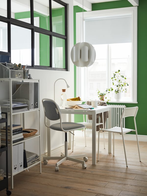 A white DRÖNJÖNS desk organiser in the dining room