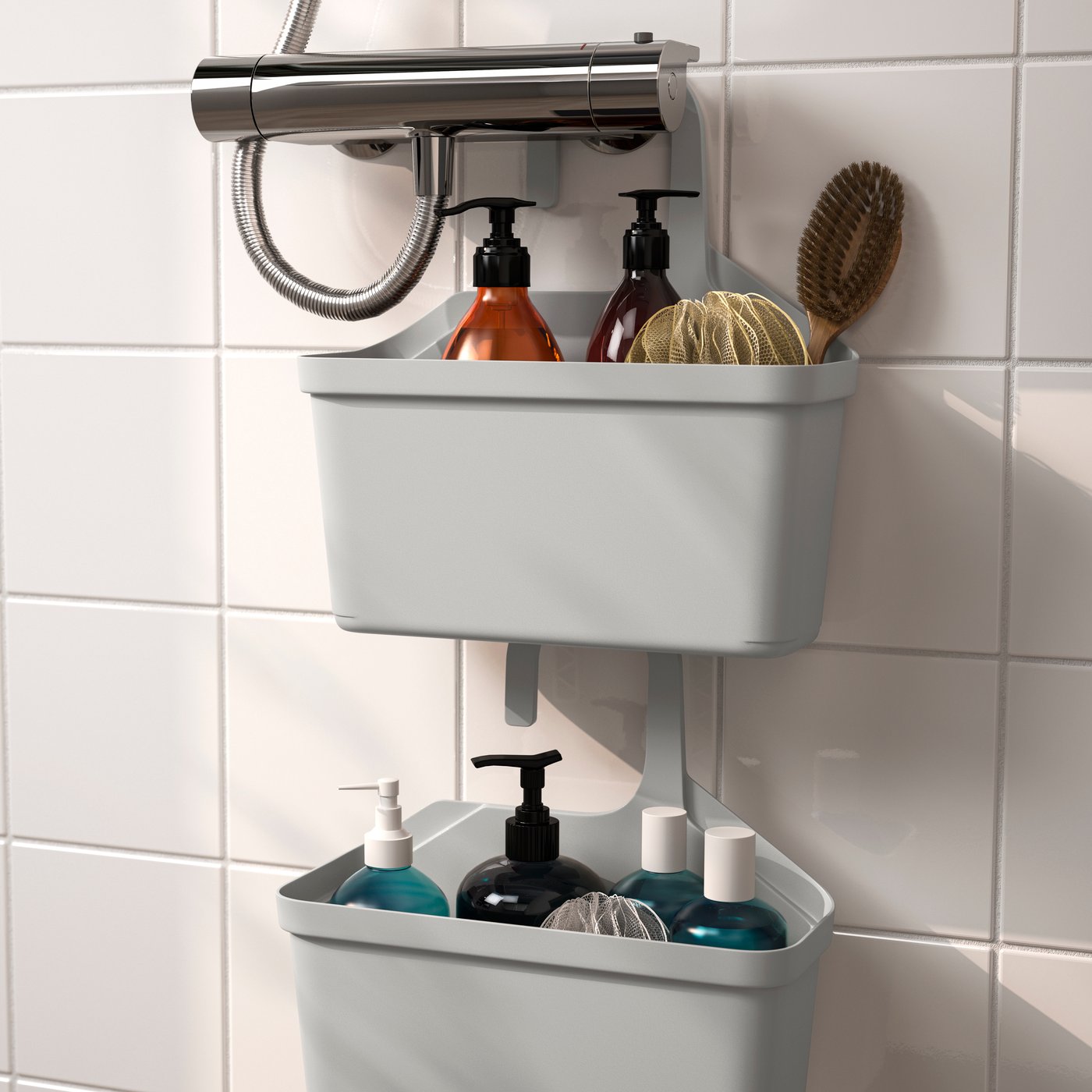 A light grey TÅNGHÄLLAN shower basket in the bathroom