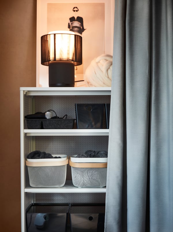 A grey GUNNLAUG sound absorbing curtain