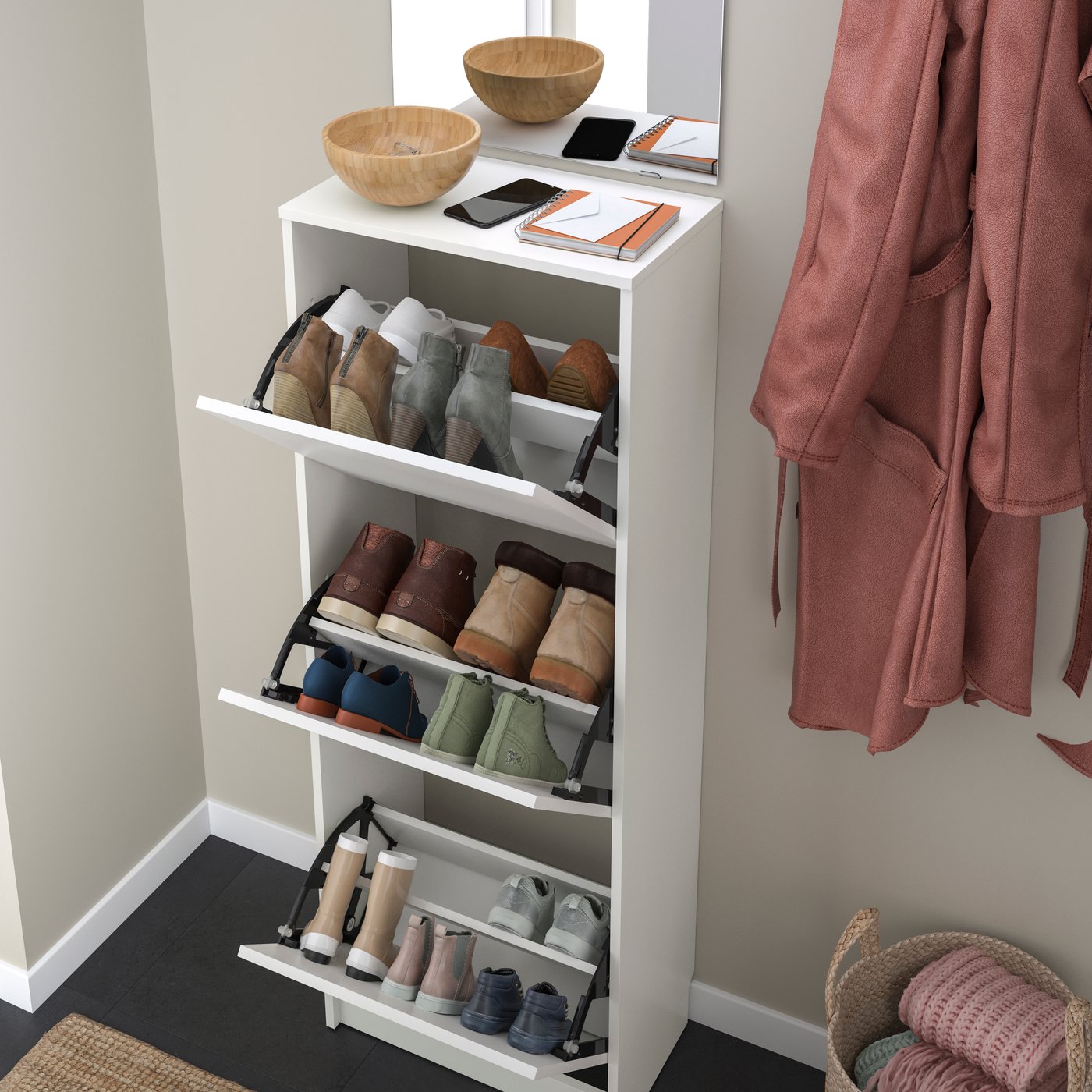 A white BISSA shoe cabinet with 3 compartments in the hallway