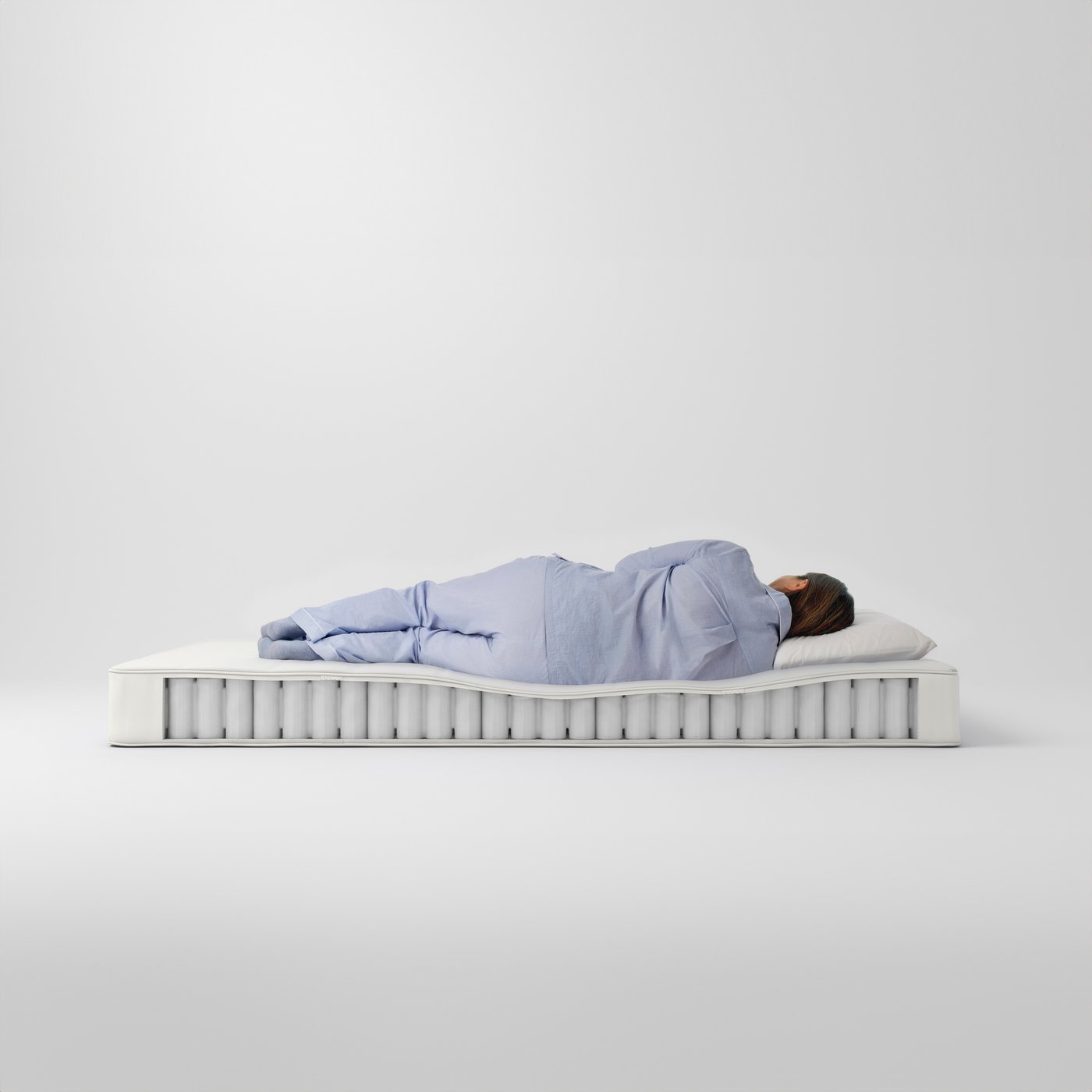 A medium firm/white VESTERÖY hybrid mattress