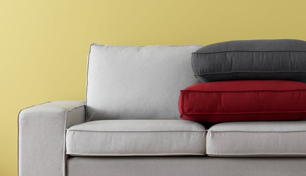 An Orrsta red KIVIK cover two-seat sofa