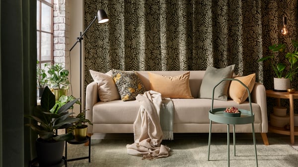A light grey-green HOLMVI throw