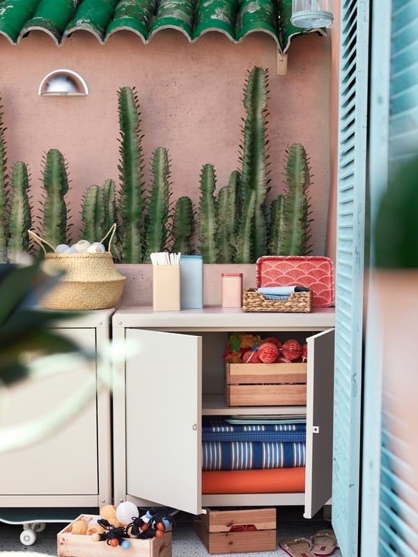 A beige KOLBJÖRN cabinet in/outdoor outside