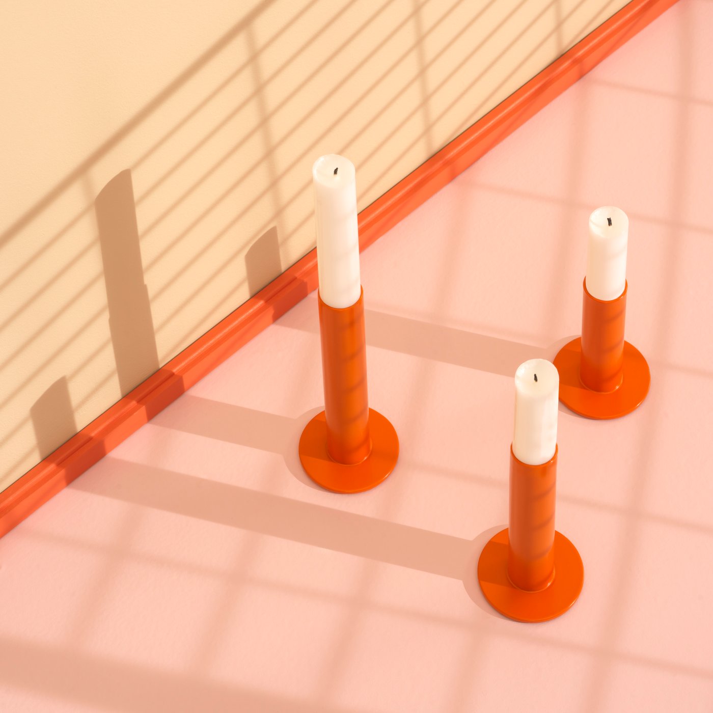An orange TUVKORNELL candle holder