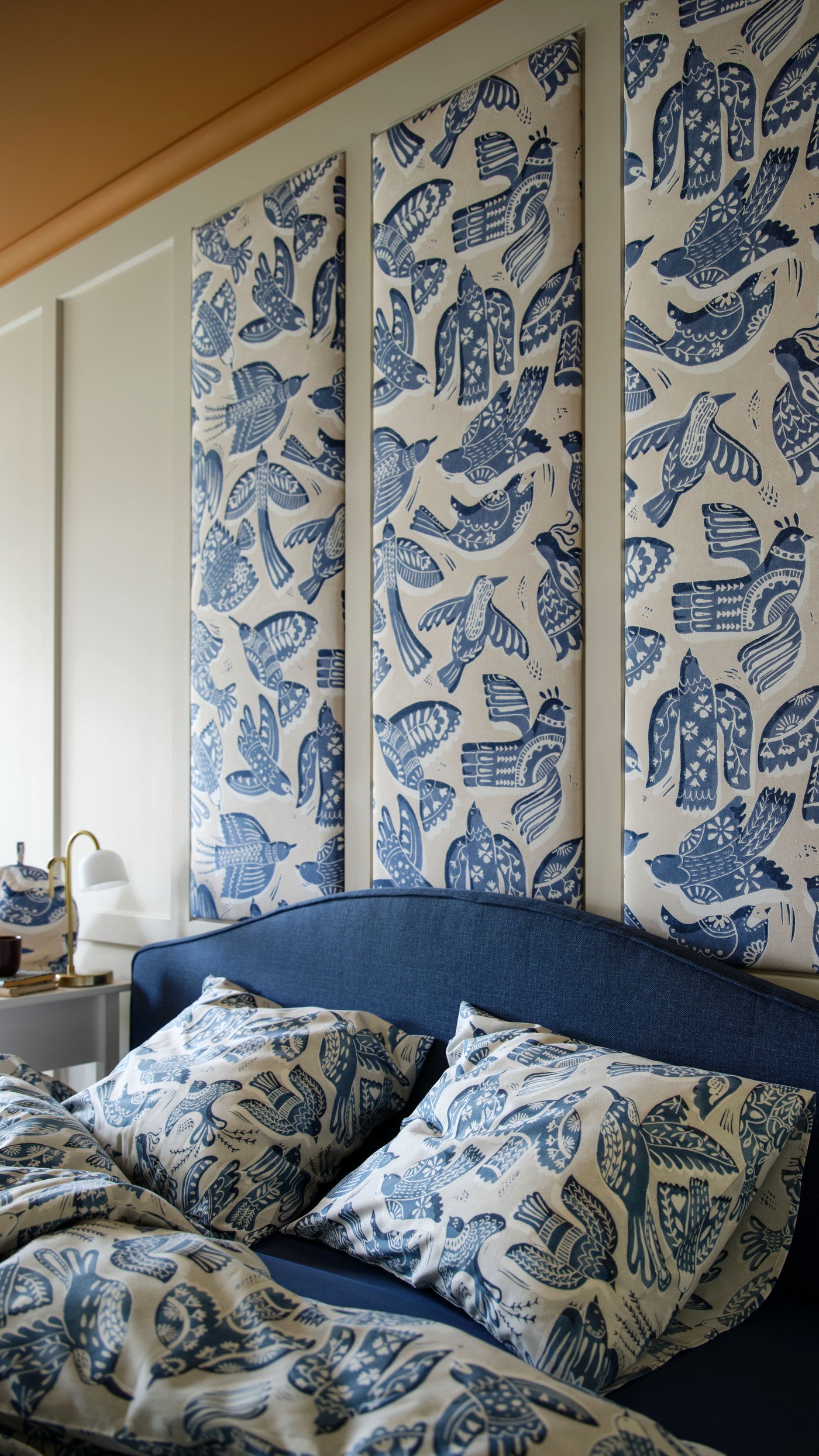 A beige/blue/bird pattern BITTERSÖTA pre-cut fabric in the bedroom