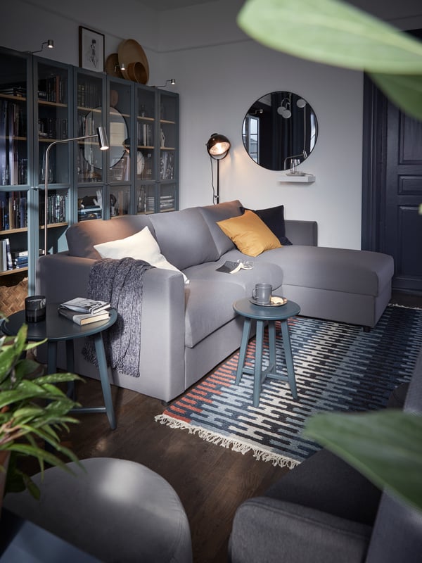 A grey VIMLE sofa in the middle of a living room