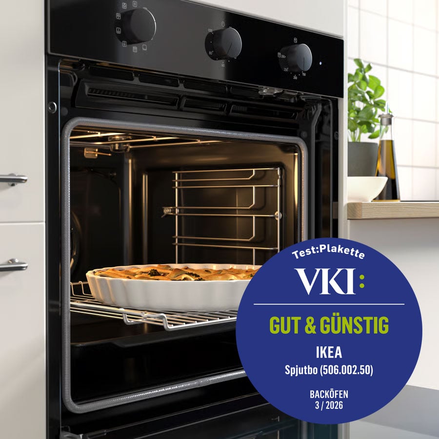 The SPJUTBO oven is integrated into a light kitchen with white tiles and a clean, minimalist design.