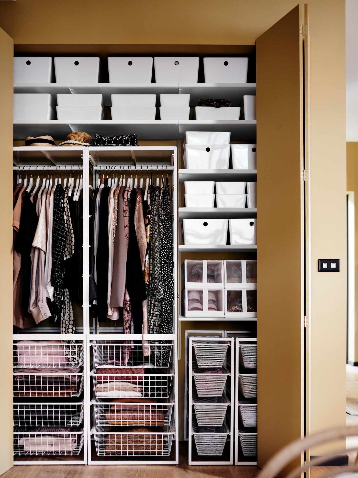 A white JONAXEL wardrobe combination in the bedroom