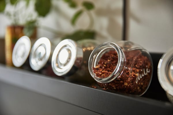 A glass/aluminium-colour RAJTAN spice jar in the kitchen