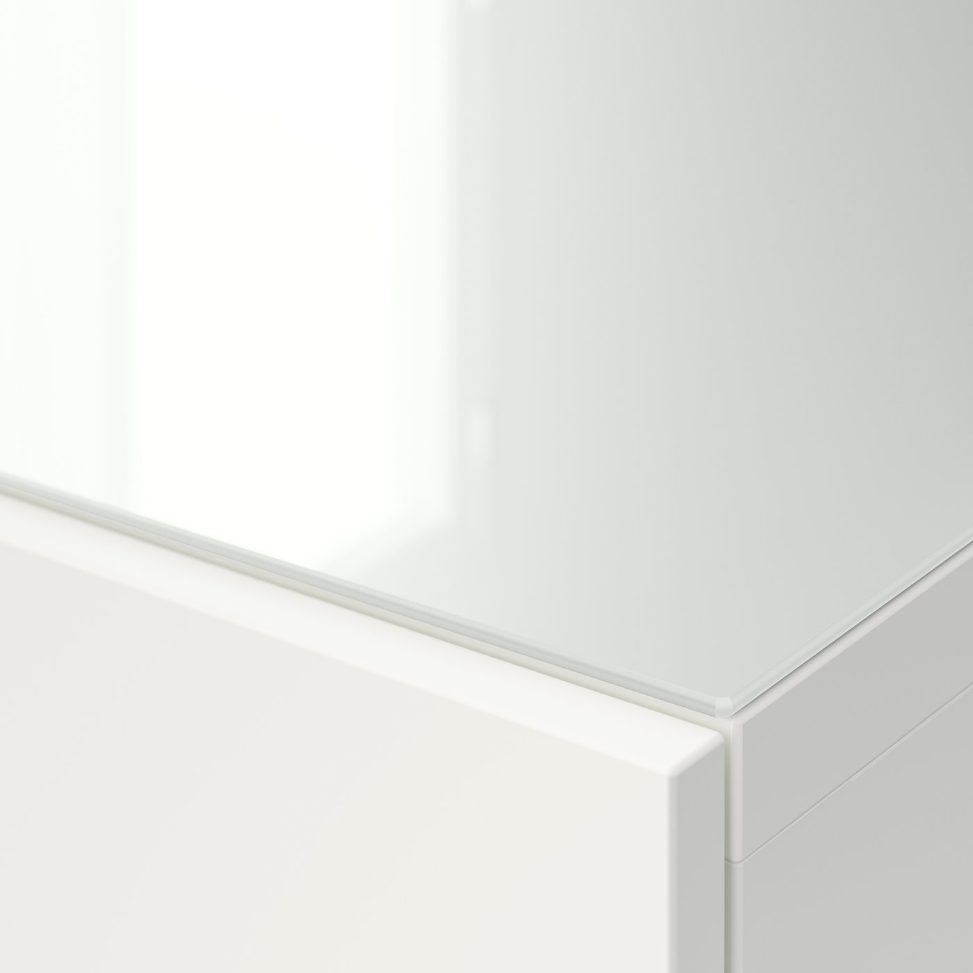A glass/white BESTÅ top panel for TV
