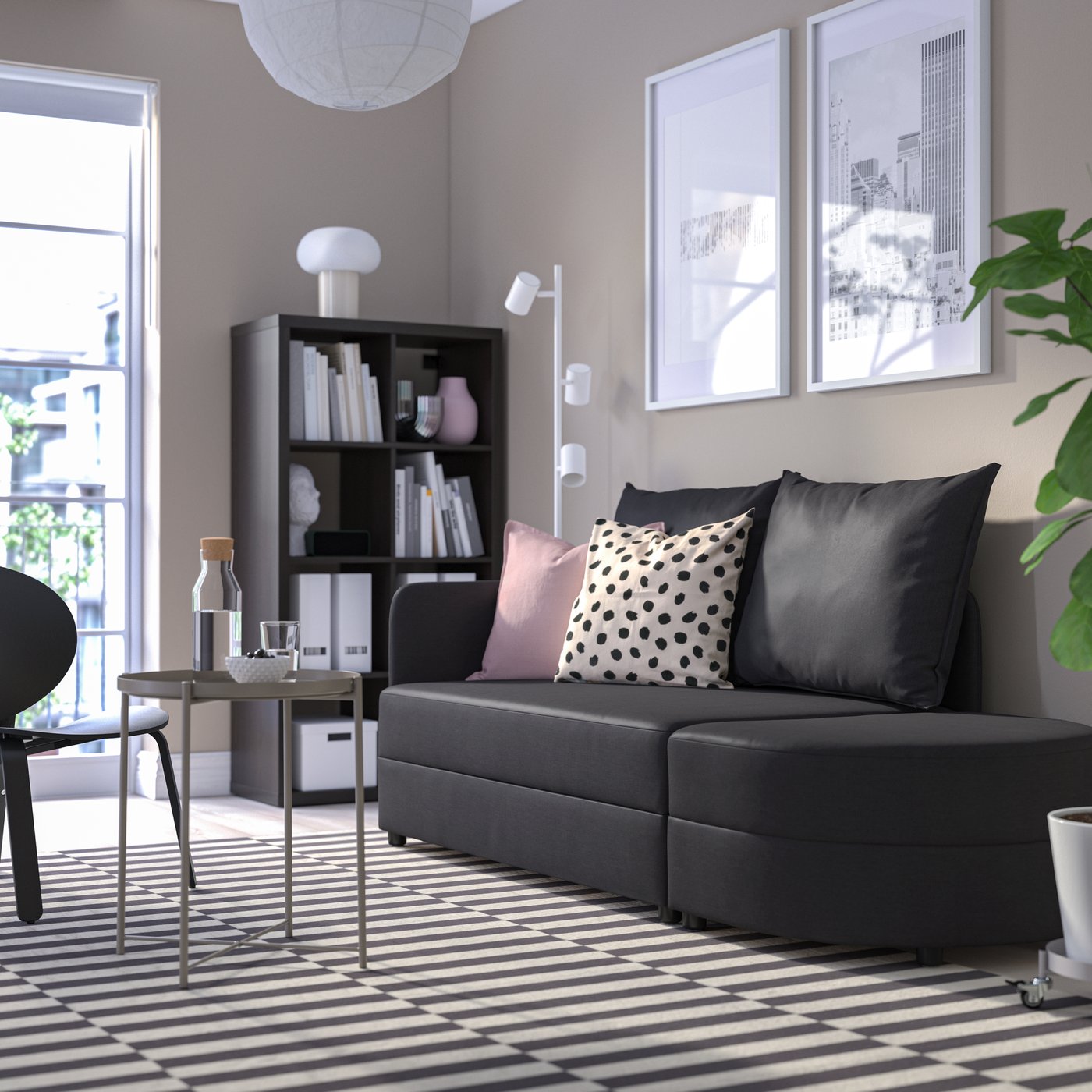 A Vissle dark grey LINDÅKRA 2-seat sofa-bed