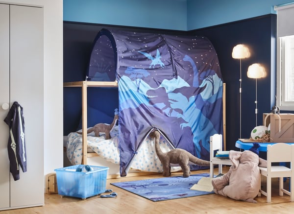 A dinosaur KURA bed tent