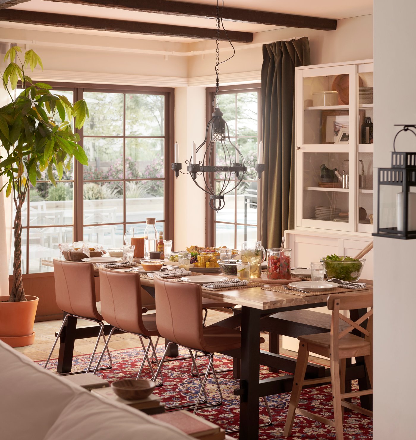 An acacia/black SKOGSTA dining table in the dining room