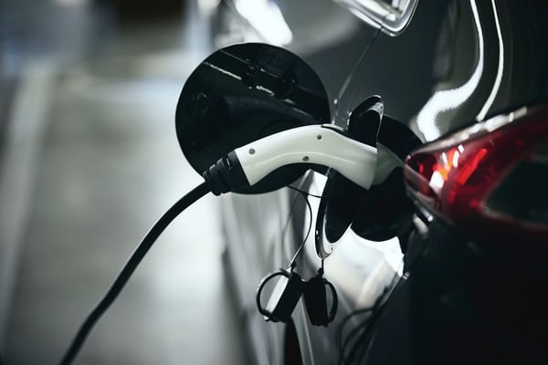 Close up of an EV car charging.