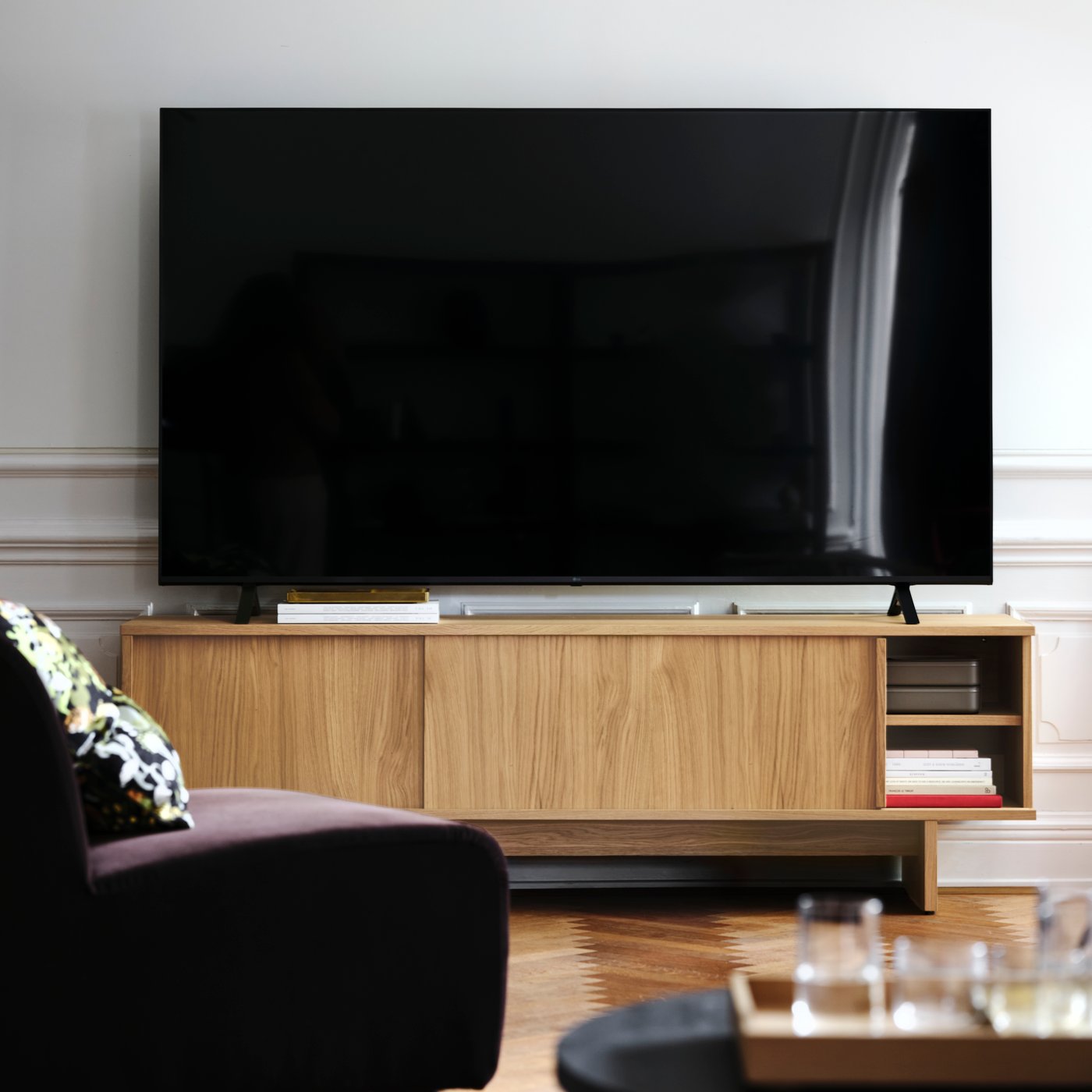 A pine veneer black STOCKHOLM 2025 side table in the living room