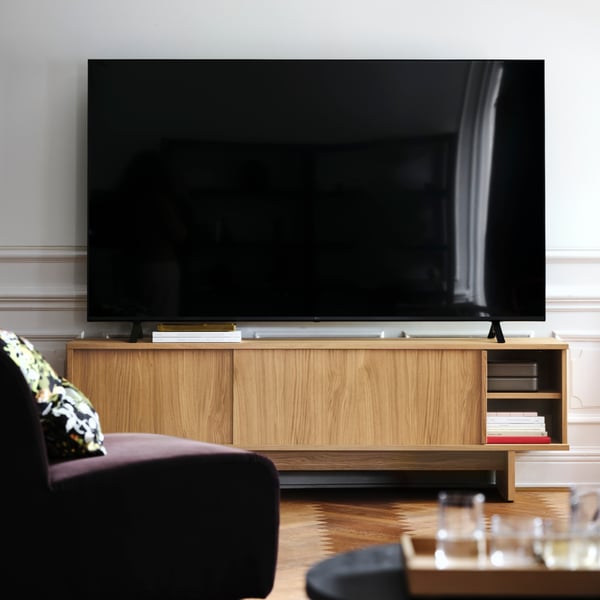An Alhamn dark brown STOCKHOLM 2025 1-seat section in the living room