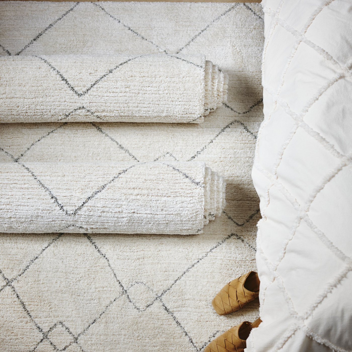 A beige TVERSTED rug, low pile