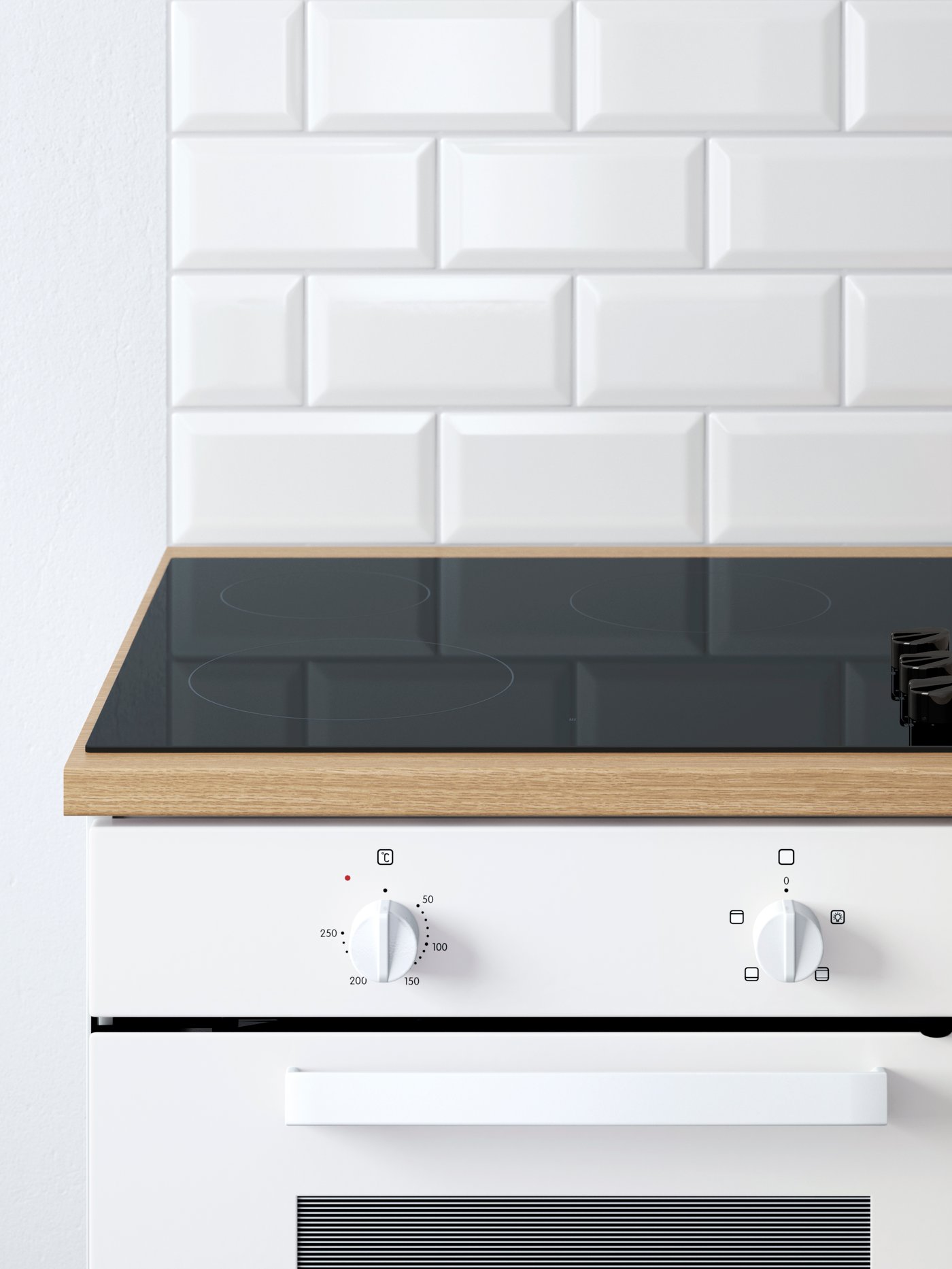 An induction hob on a KNOXHULT worktop with a a white LAGAN oven underneath.