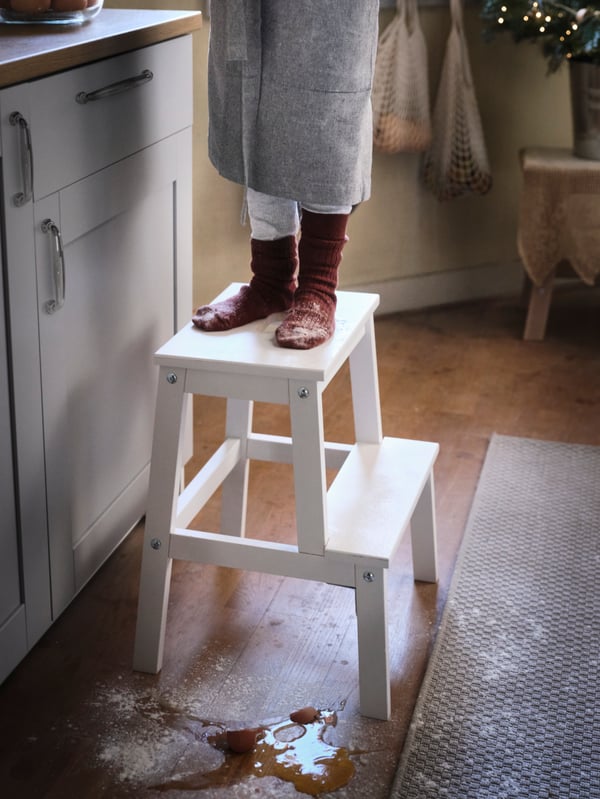 A white BEKVÄM step stool in the kitchen