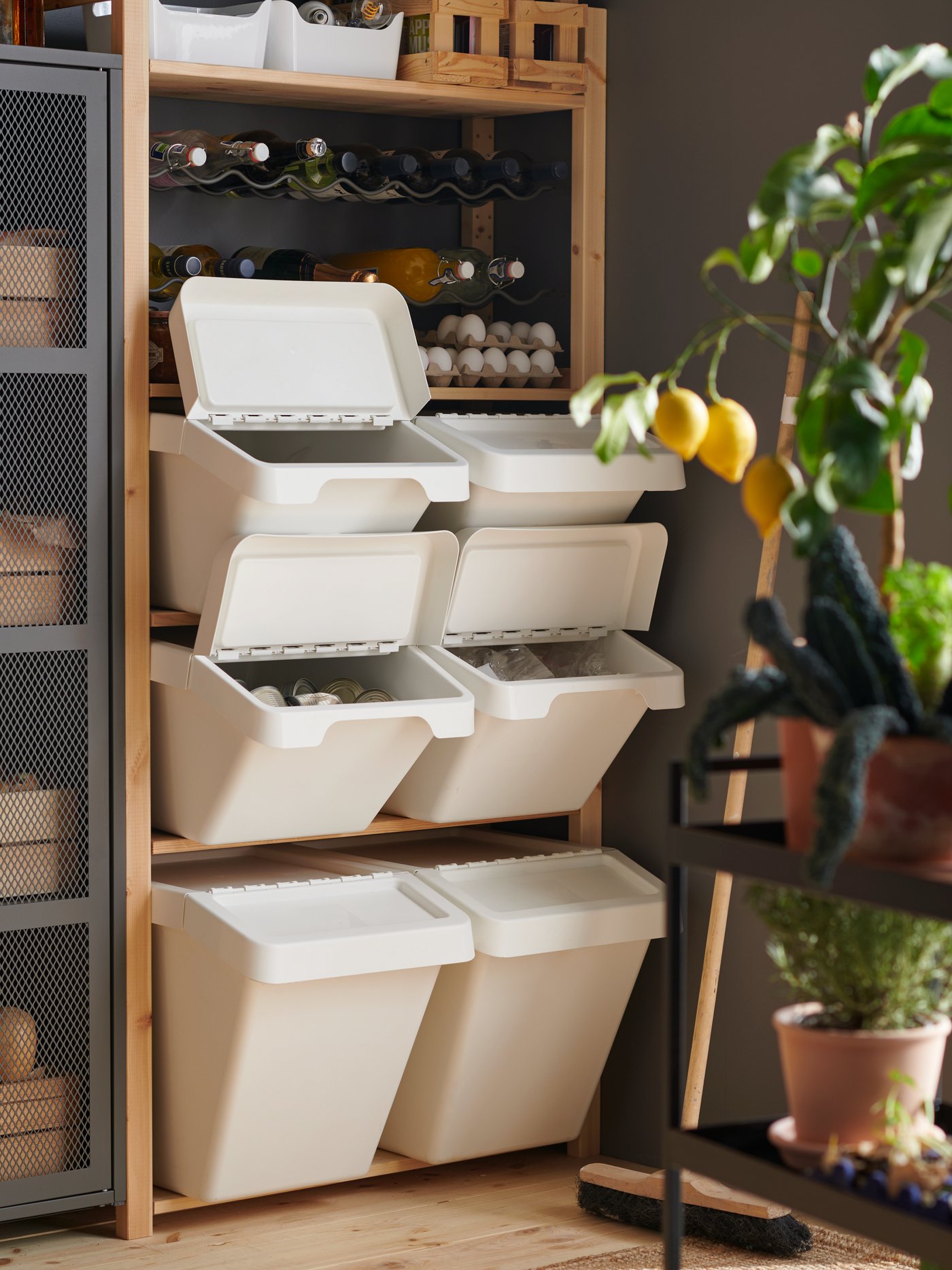 A white SORTERA waste sorting bin with lid outside