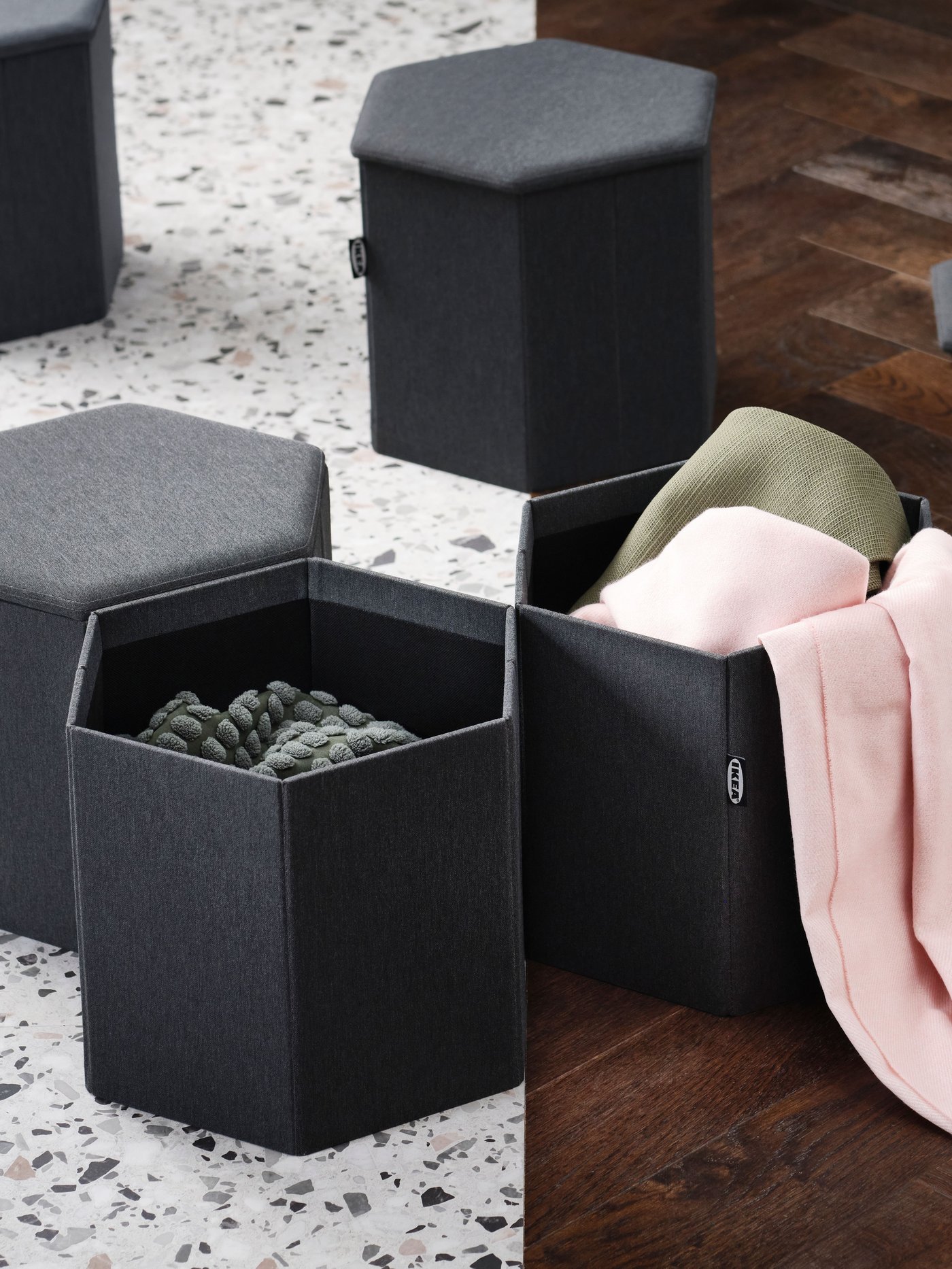 A Knisa dark grey KJUGE pouffe with storage