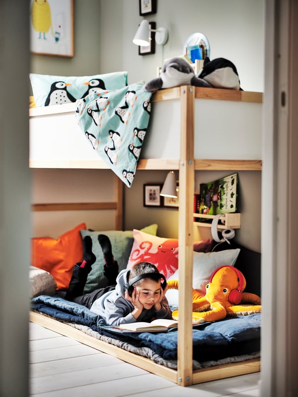 Kura bed with a child reading