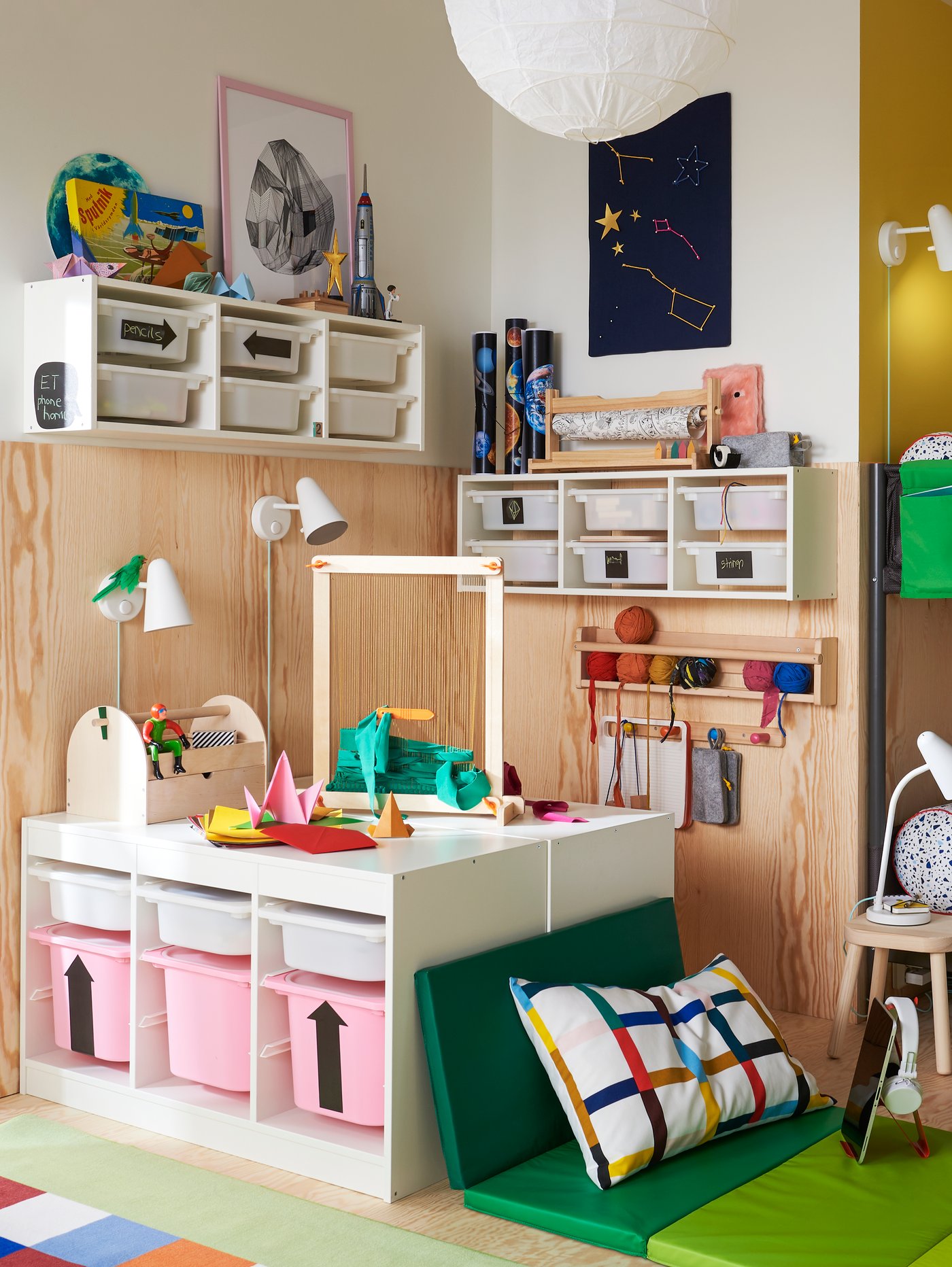 A light white stained pine FLISAT wall storage in the childrens room