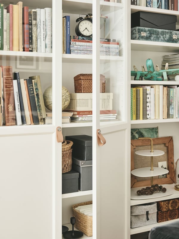 Close-up of a BILLY bookcase with glass doors.