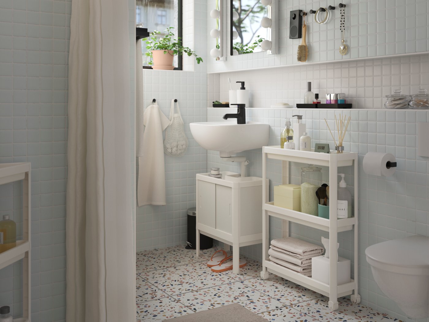 A white VESKEN trolley in the bathroom