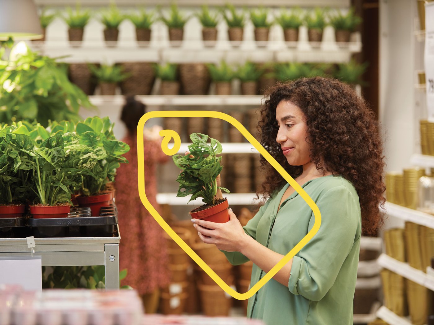 A woman sees a product with a good IKEA Family price.