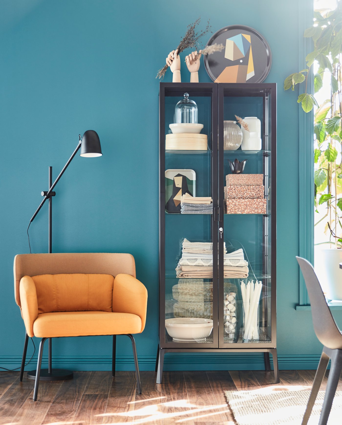 A black SKURUP floor/reading lamp in the dining room