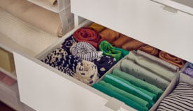 A white SKUBB box in the bedroom