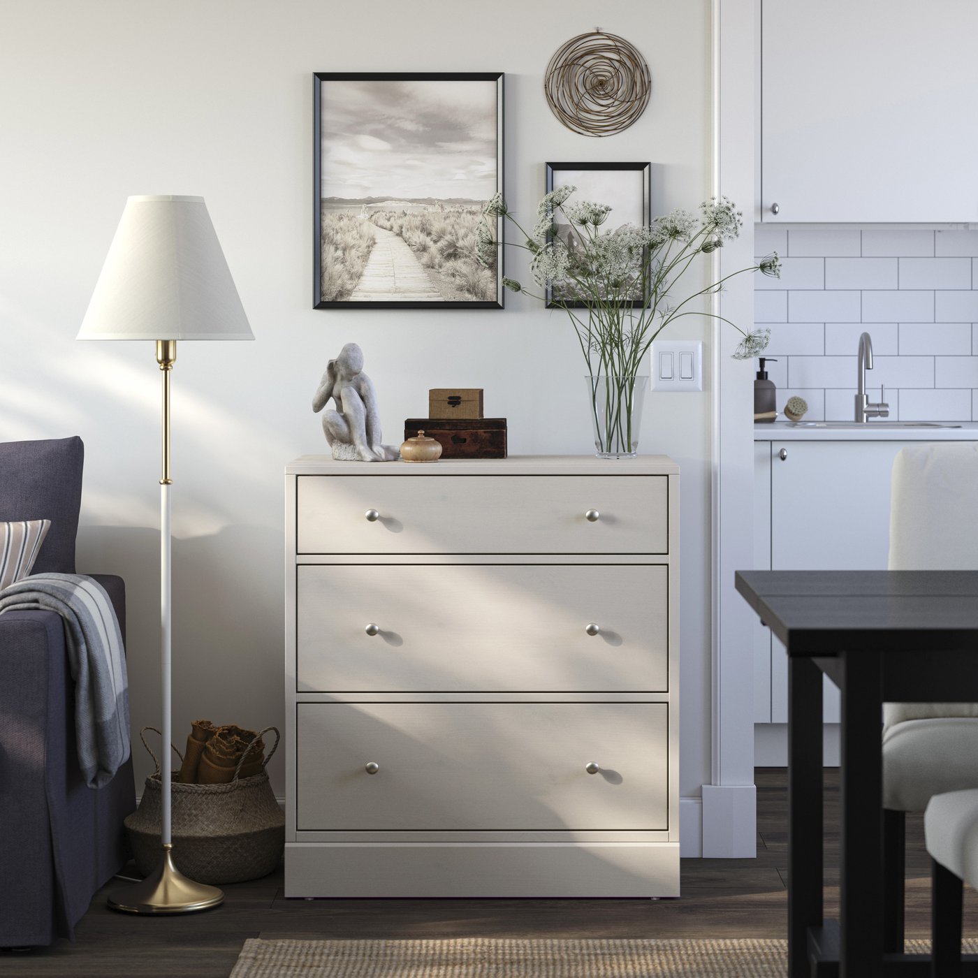 A greige HAVSTA chest of drawers in a living room, with decorative objects placed on top.
