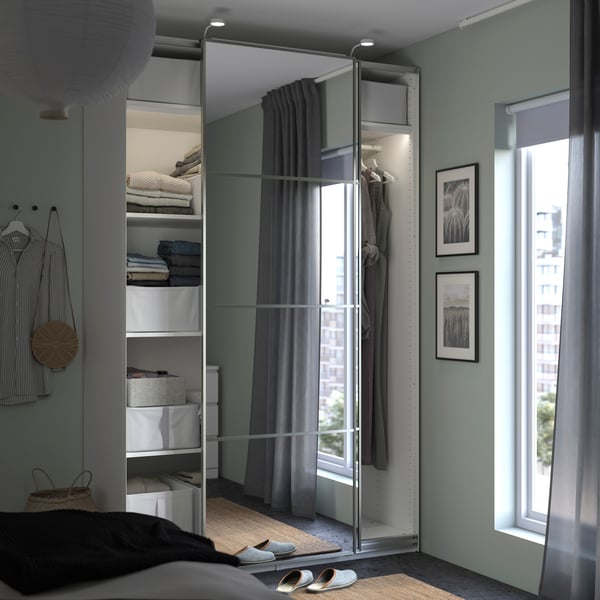 A white/mirror glass PAX wardrobe with sliding doors