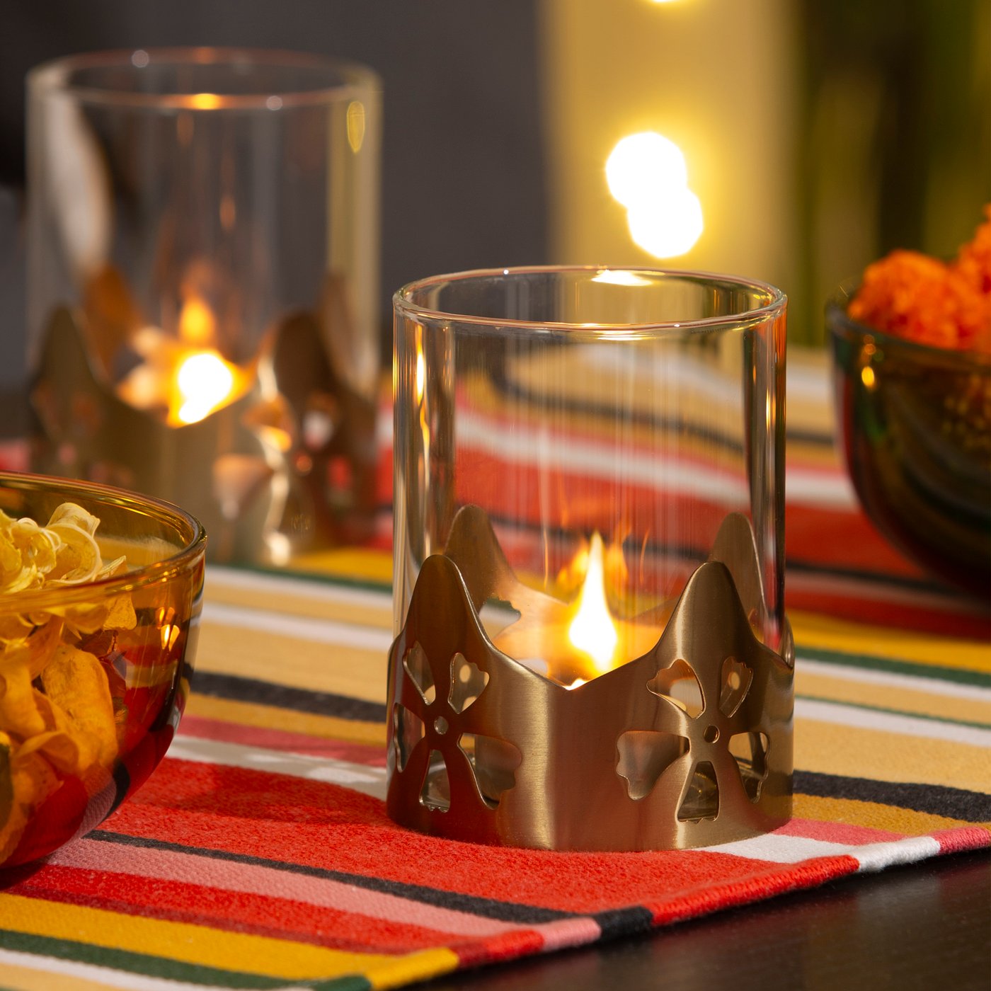 A glass/gold-colour AROMATISK tealight holder