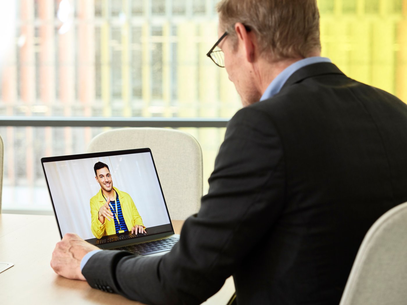 man sitting at computer