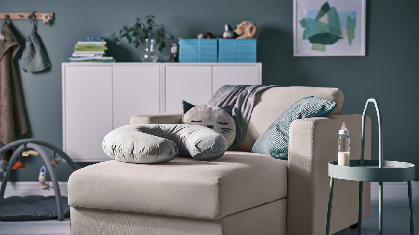 A grey LEN nursing pillow